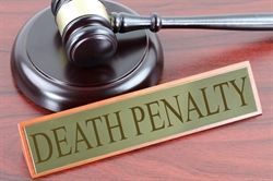 [ai] A wooden gavel and a sign reading "DEATH PENALTY" placed on a polished wooden surface, symbolizing legal proceedings.